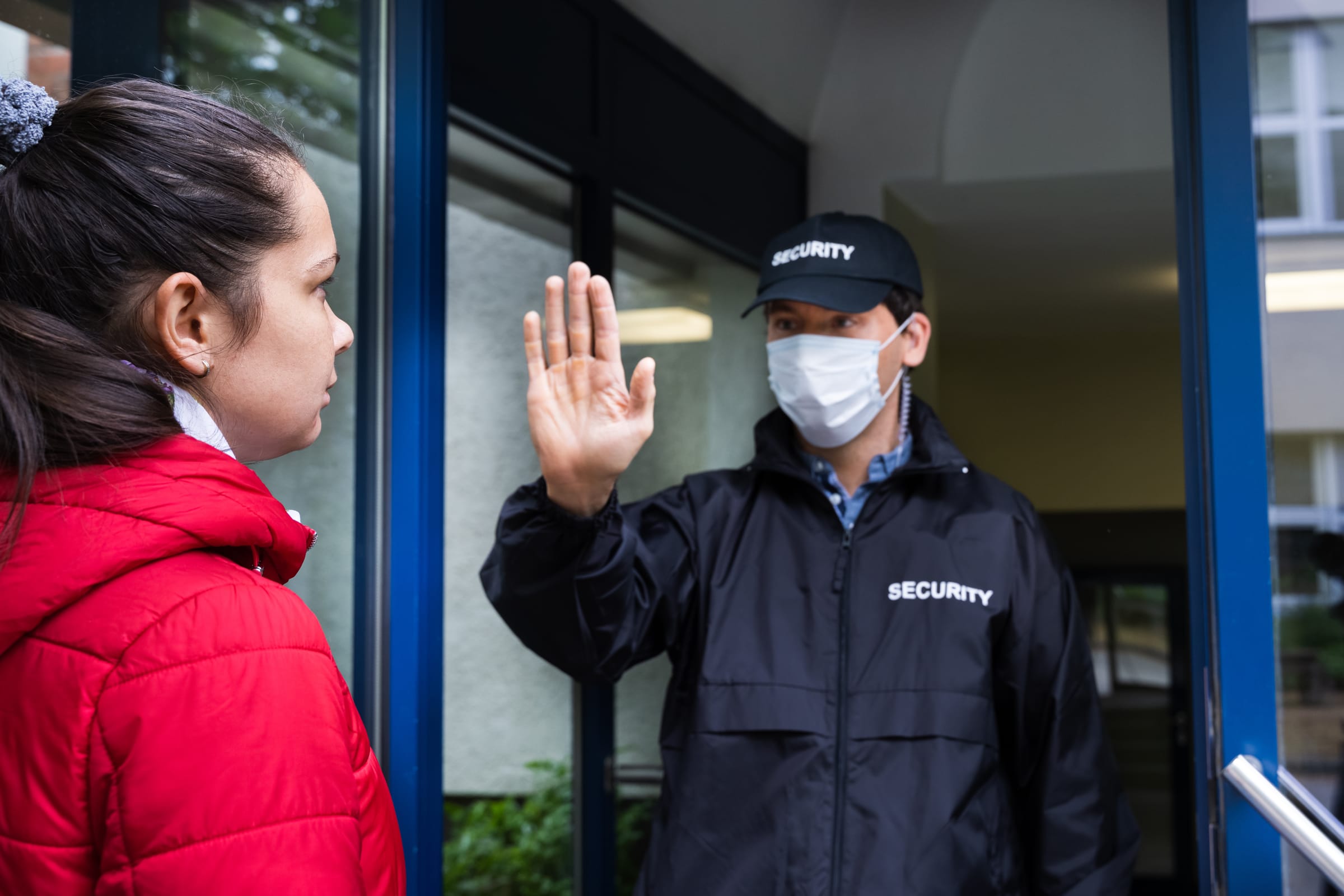 Hotel security guard managing guest access
